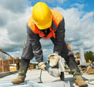 builder working with cutting grinder